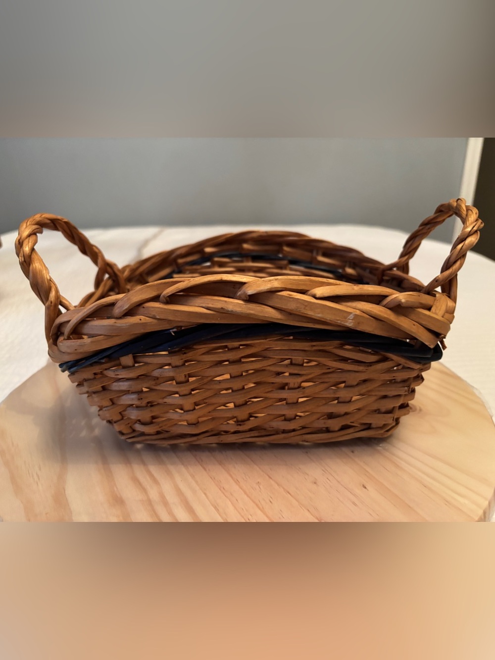 Small handwoven rectangular willow wicker basket.